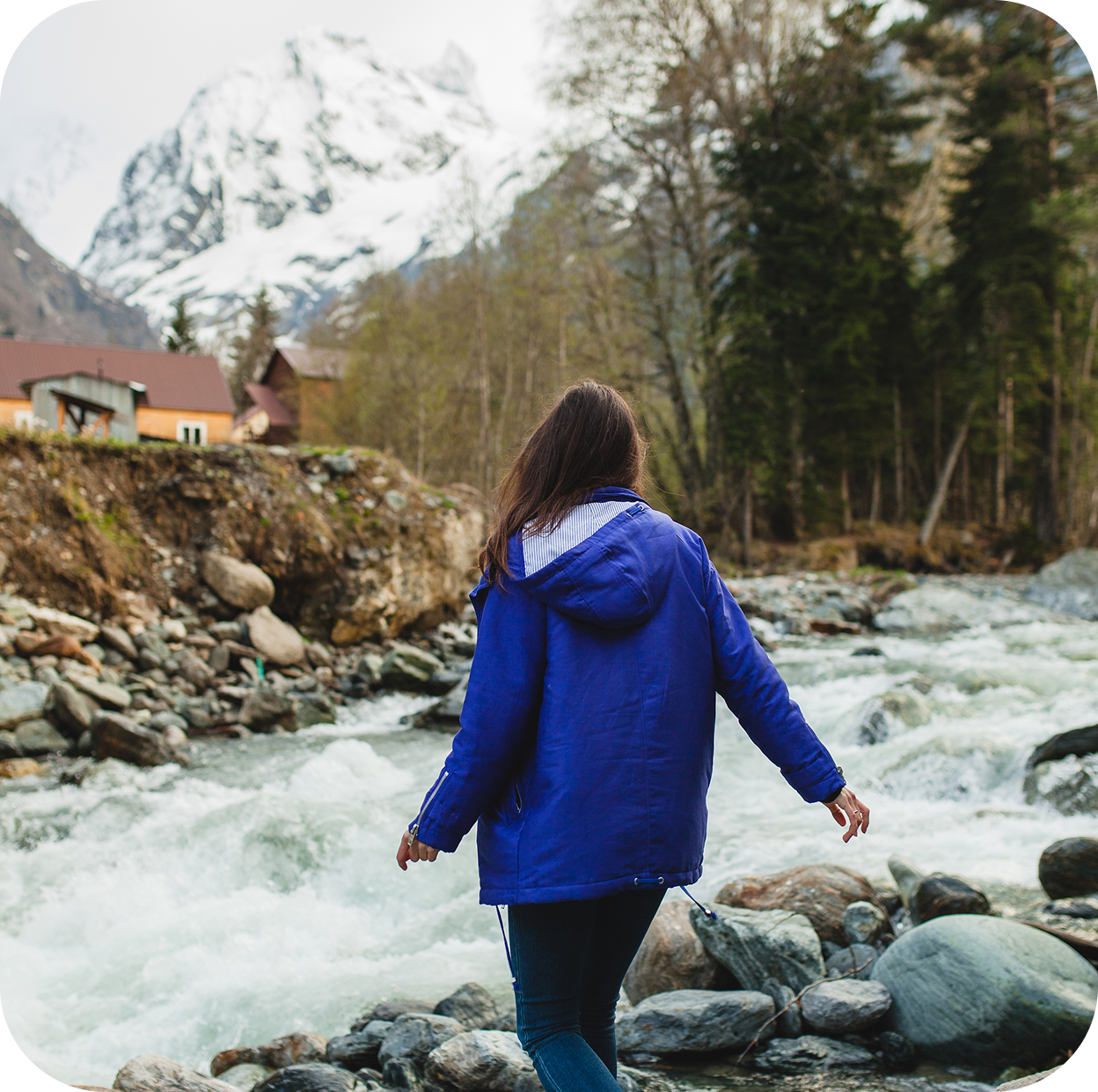 young hipster woman walking rocks river winter forest 1